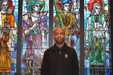 Mr. Dola Osaga smiles for the camera in the Dowling Narthex.
