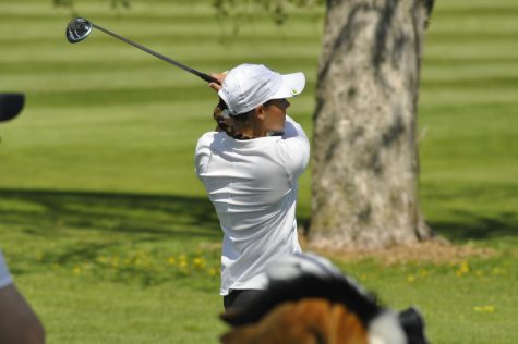Fisher tees off at one of the first golf meets of the season (R. Gray)