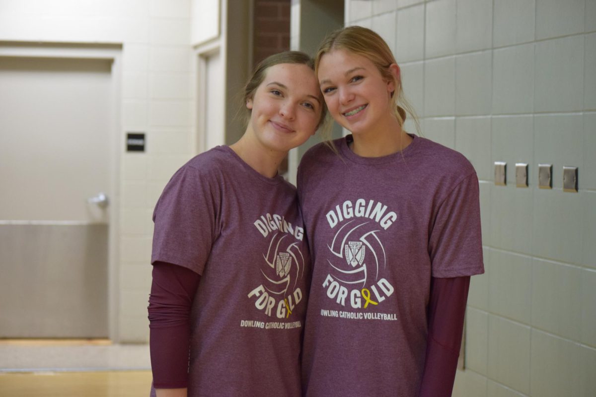Bella Simons and Kaylie Klein smile for the camera after their win against Waukee.