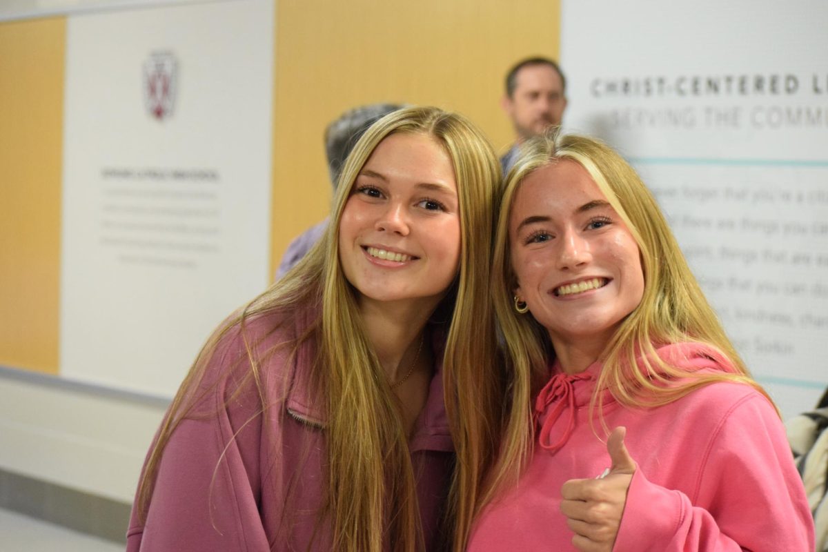 Lily Calvert and Emily Heitzman smile for the camera.
