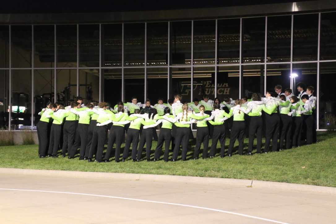 The Vanguard gathers before the Pella Marching Dutch Invitational on September 23. [Dowling Catholic High School Bands]