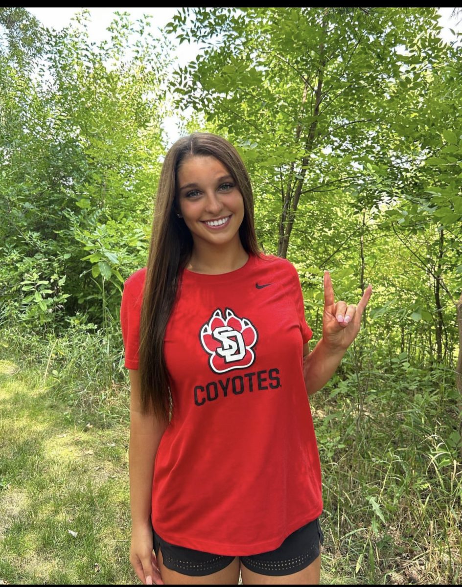Abby Wilcox poses for her announcement post to the University of South Dakota.
