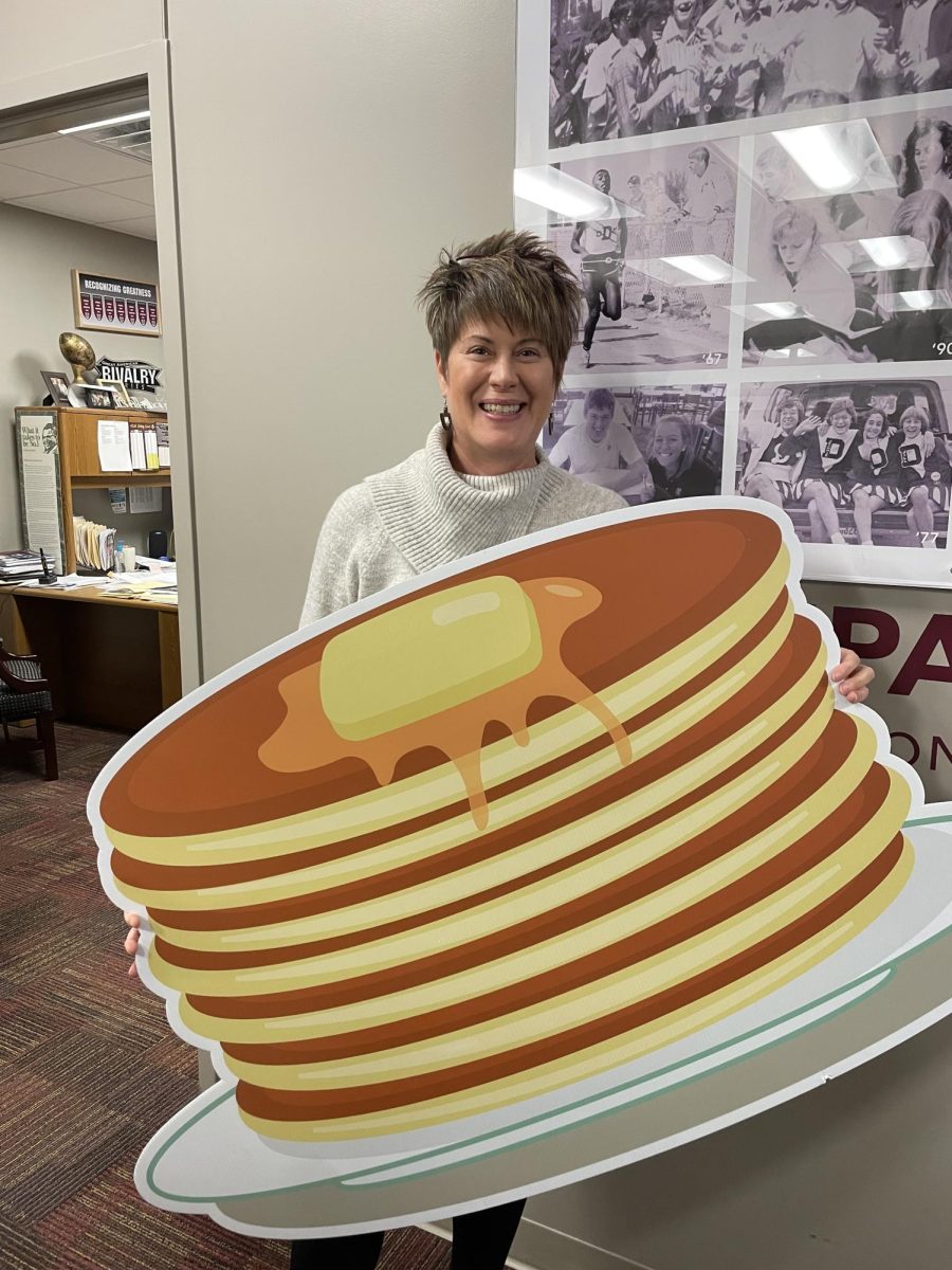 Bonnie Bronson, events and community engagement manager at DCHS, poses with a giant stack of pancakes.
