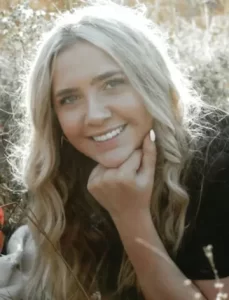 Ava Vaske smiles into the camera before her cancer diagnosis. 
[Photo Courtesy The Des Moines Register]