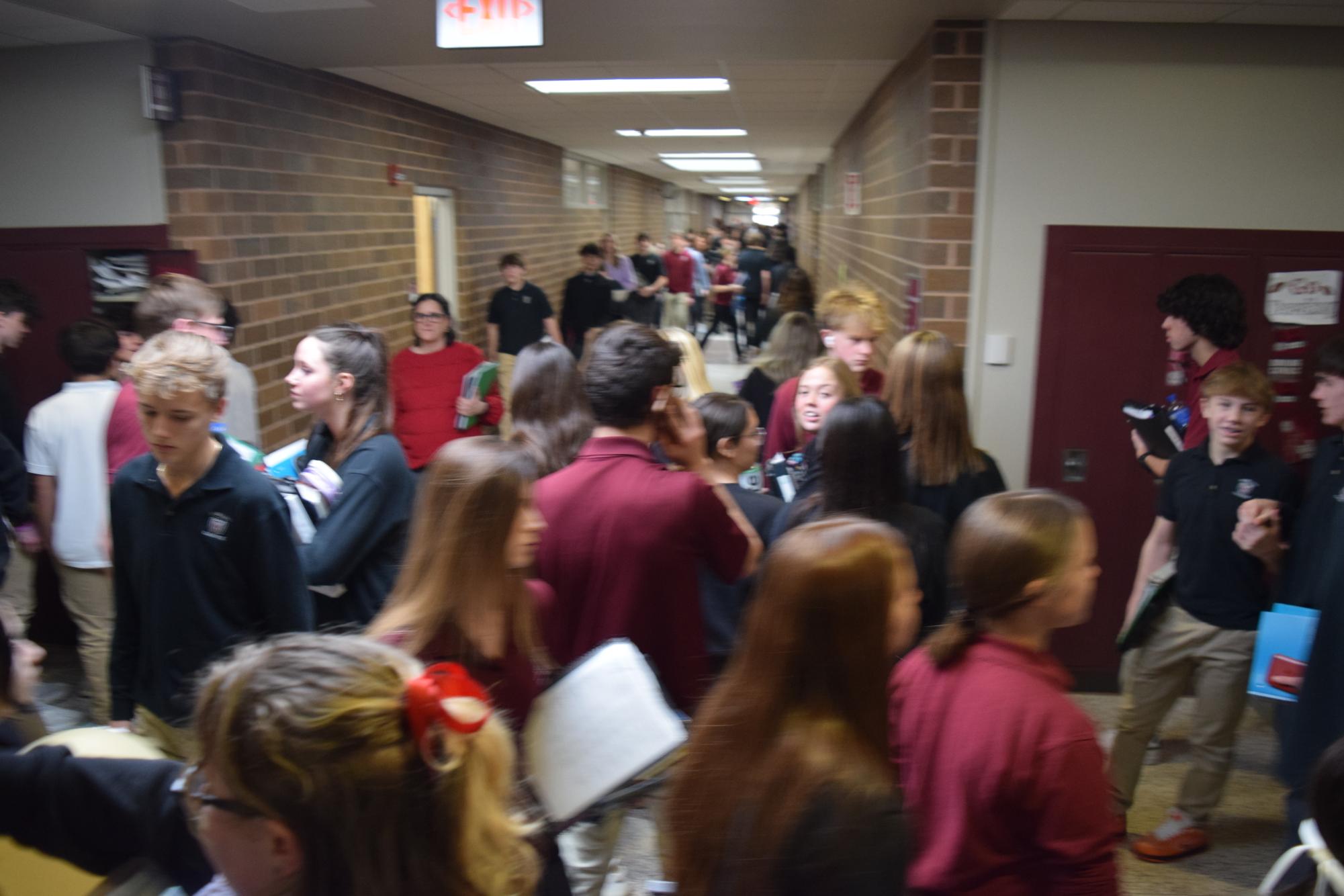 Students and teachers move through the hallways on a busy Tuesday afternoon.