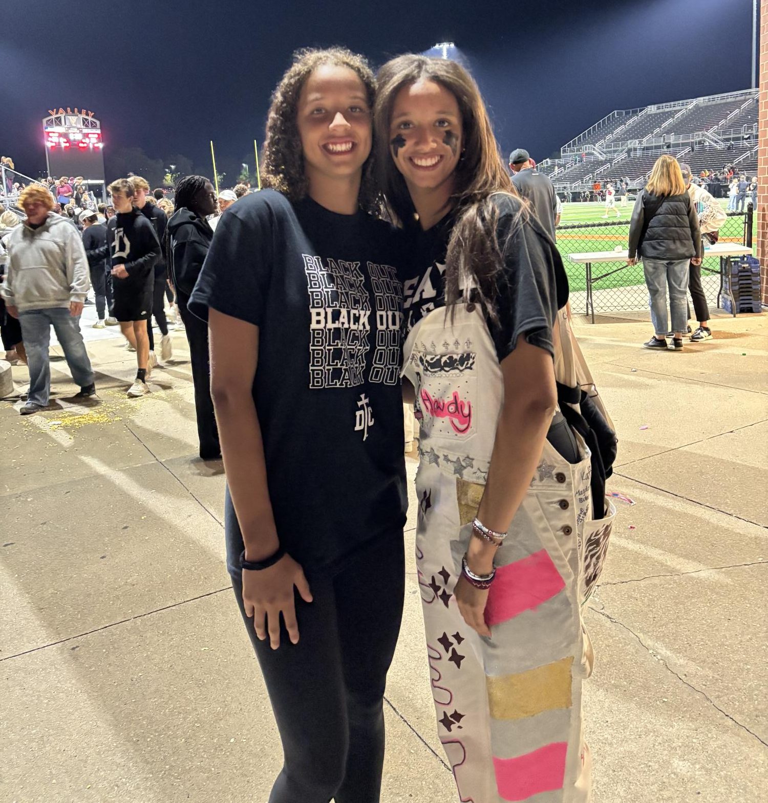 Alexia (right) and her sister Olivia Meredith (left) smile for the camera.