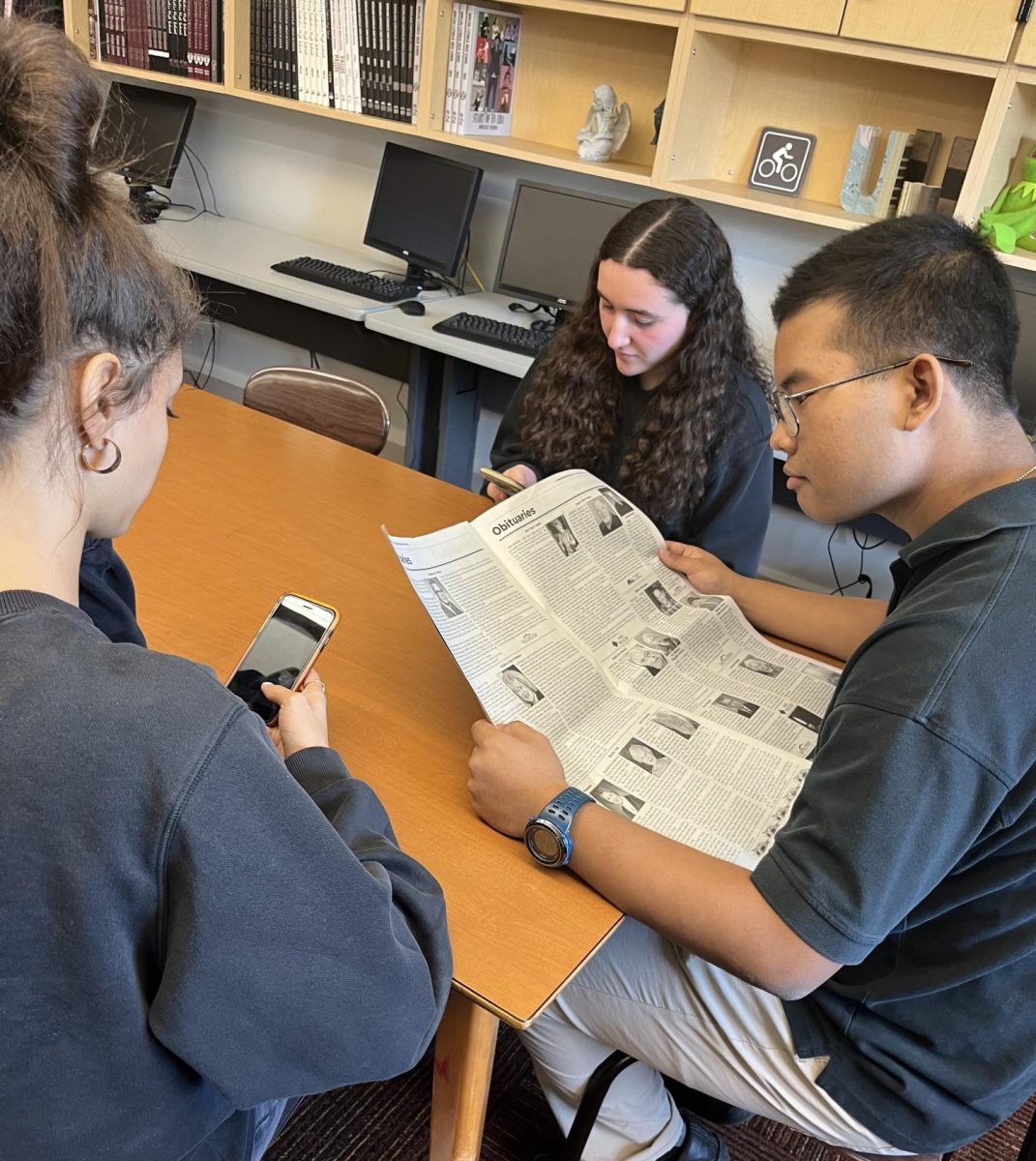 Does this photo seem off to you? Even just the image of a person reading a newspaper is not commonplace in today's world.