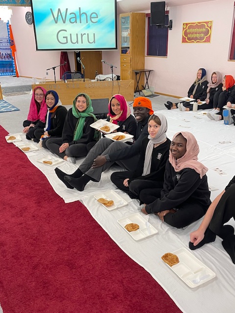 Students enjoy the langar during a field trip to the Gurdwara.