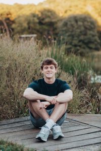 Lucas Paoli smiling in his senior photos.