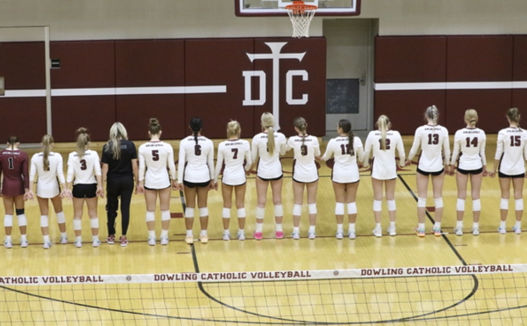 Dowling Varsity volleyball team is led in prayer by Denny O'Grady