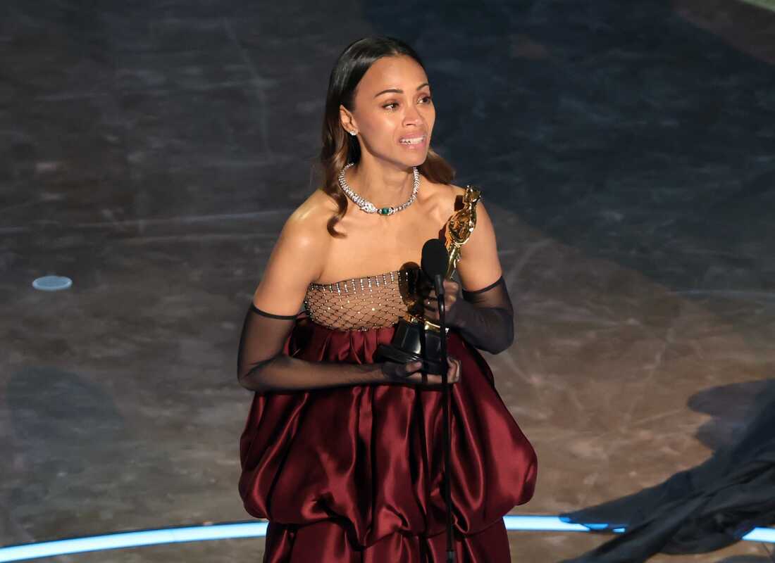 Zoe Saldaña accepting her award for Best Supporting Actress at the 2025 Oscars
