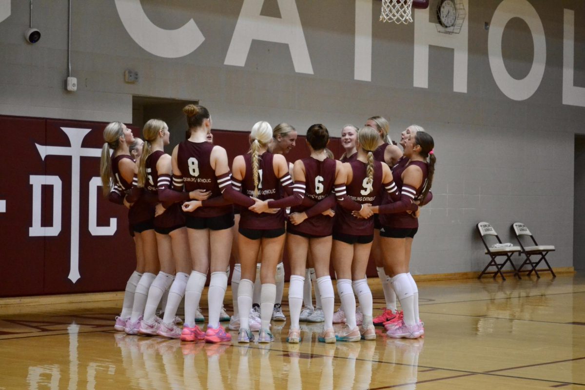 The DCHS volleyball team does their pregame hype cheer.