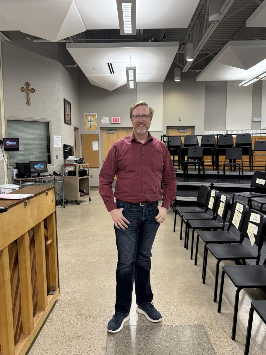Mr. Bradley Wilson poses in the DCHS choir room after one of his first jazz choir rehearsals.