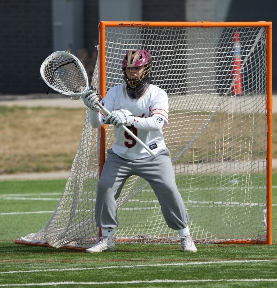 Luther guards the goal during a game.