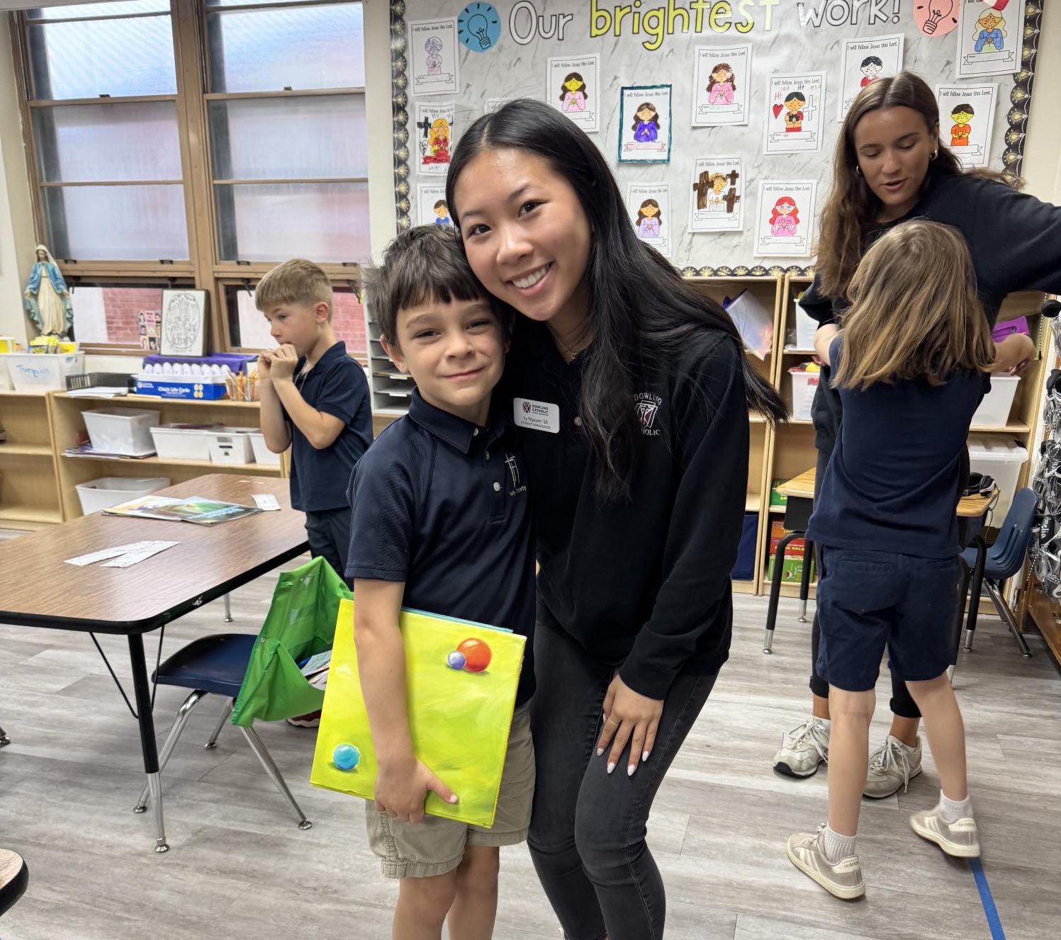 Ly Nguyen posing with an elementary student. (Courtesy of Ly Nguyen)
