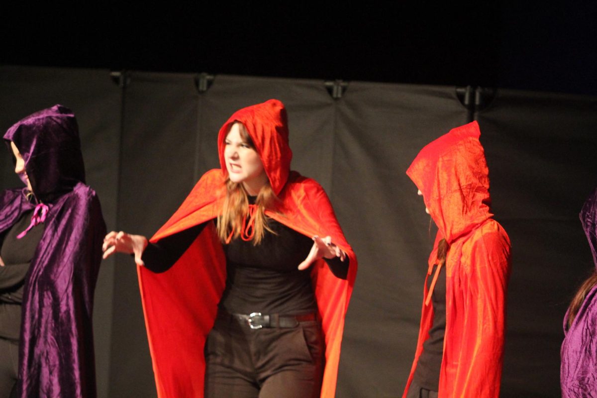 Dawson Huinker acting on stage. 