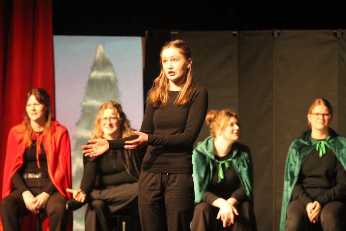 Meara Wallace acts out a scene about Hansel and Gretel.