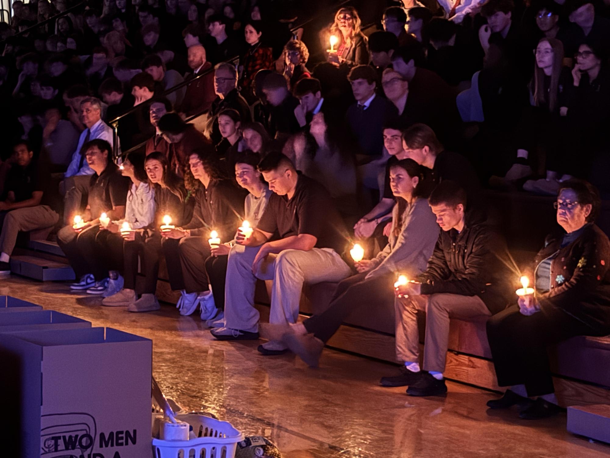 Some of the senior class holding candles during Candlelighting.