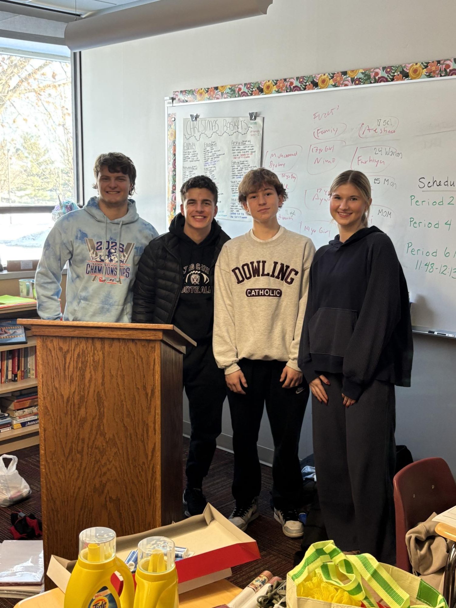 Ben Hall and his group take a picture before wrapping their gifts. 