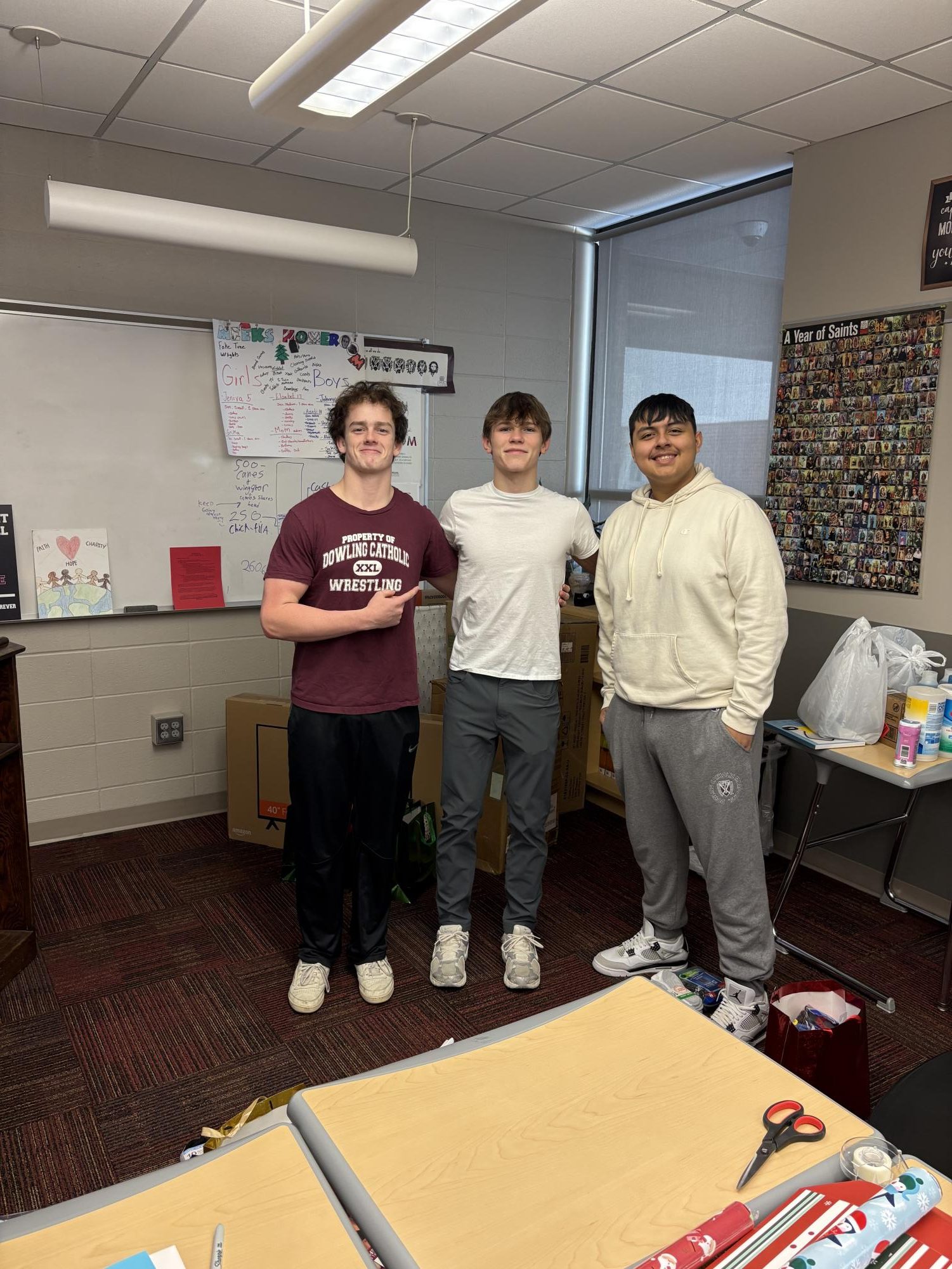 Grant Touney, Airic Conn, and Juan Garcia take a picture together.