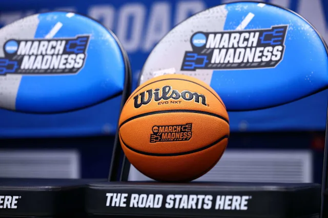 An iconic view of the March Madness bench and a reminder that all roads lead to the madness.