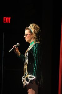 Bigelow sings a solo at Foy School of Irish Dance's Hooley, a performance to prepare for St. Patrick's day