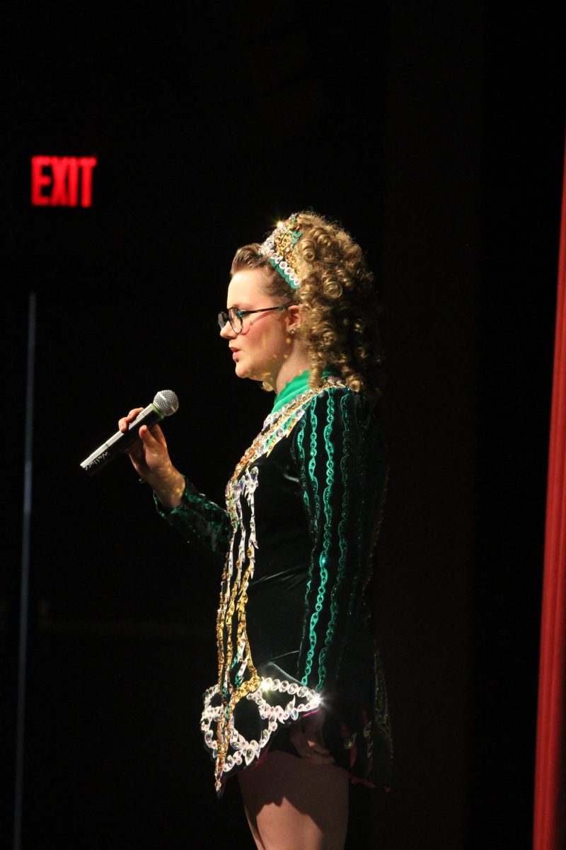 Bigelow sings a solo at Foy School of Irish Dance's Hooley, a performance to prepare for St. Patrick's day