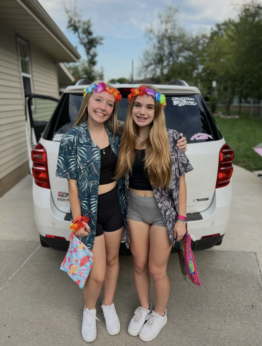 Juliana and I posing before our first ever high school football game