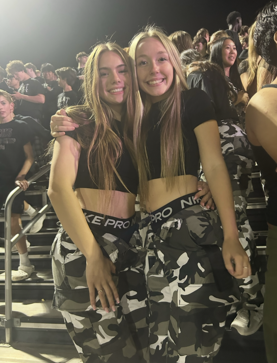 Juliana and I posing for a picture at one of our junior year football games