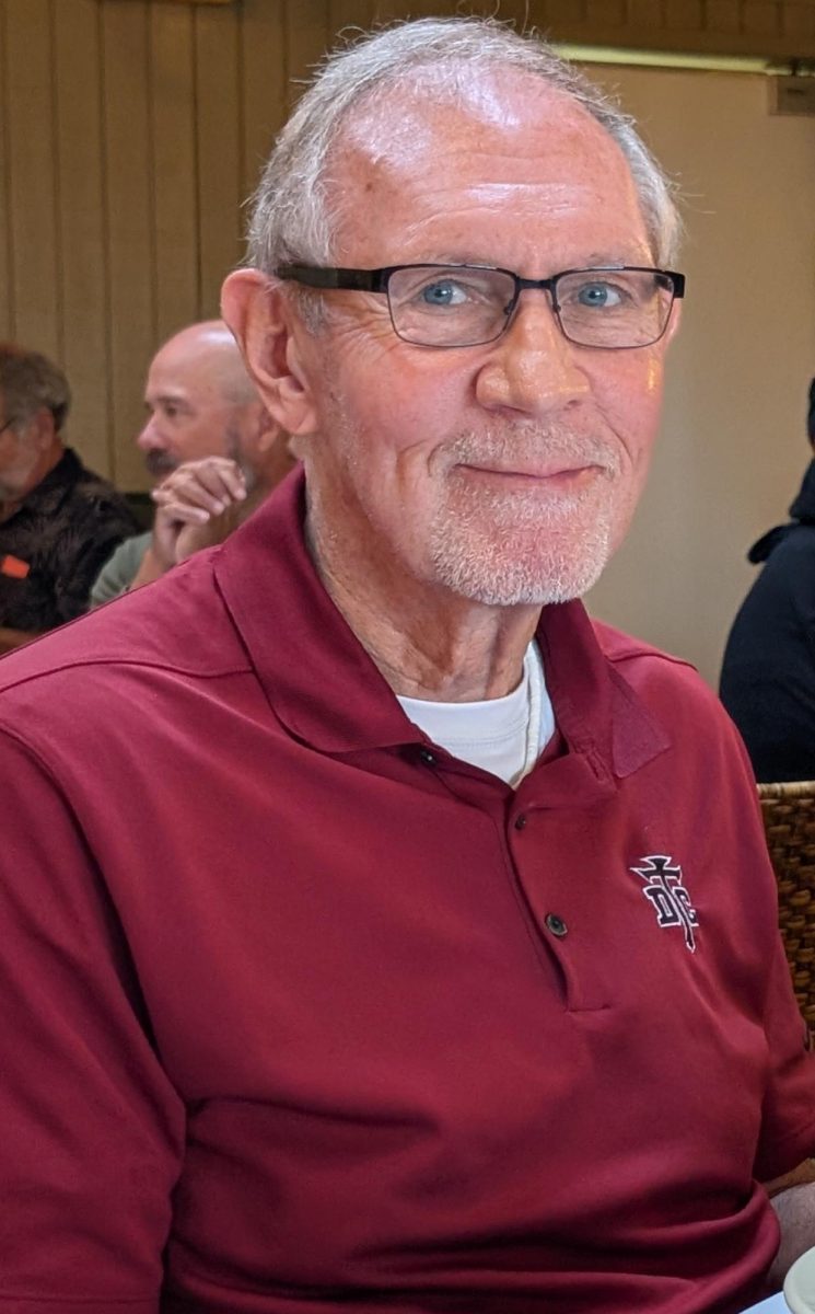 Lark smiles for a photo at a conference.